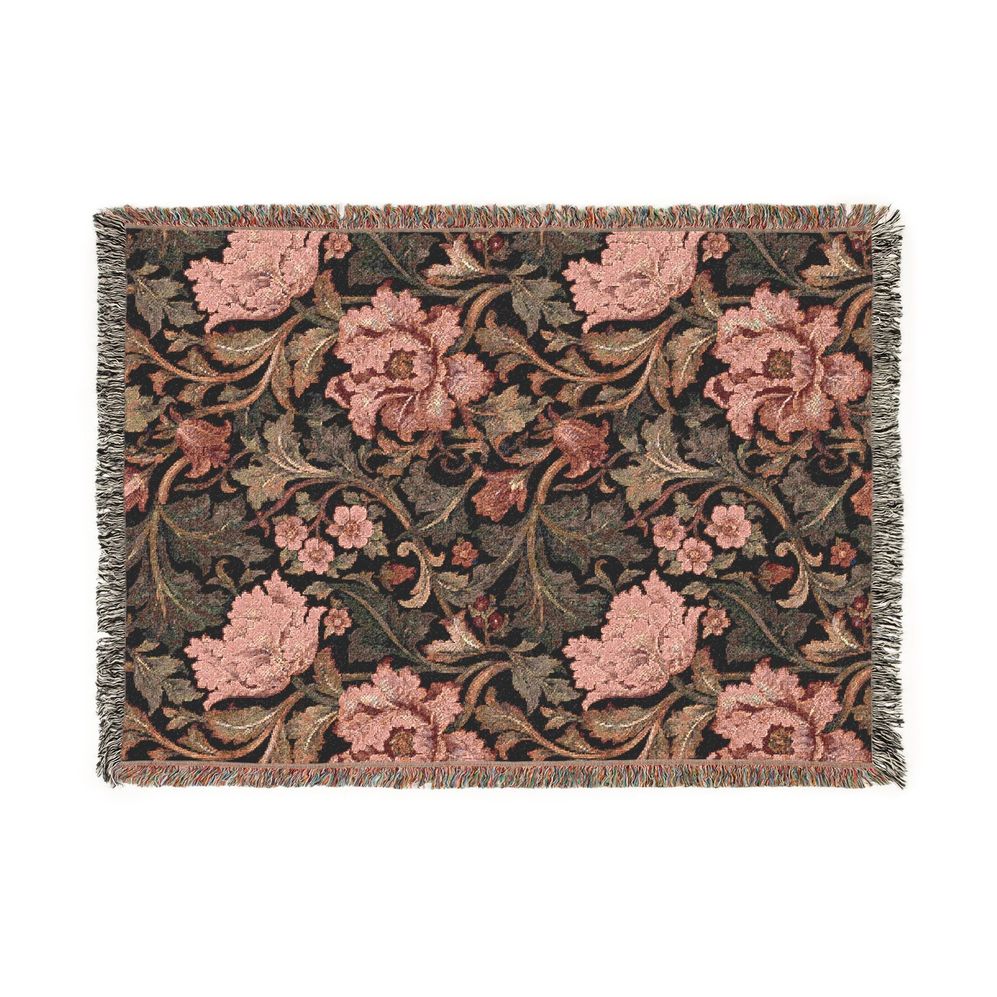 A rectangular woven throw blanket with a floral pattern, featuring pink flowers and green leaves on a dark background with fringed edges.