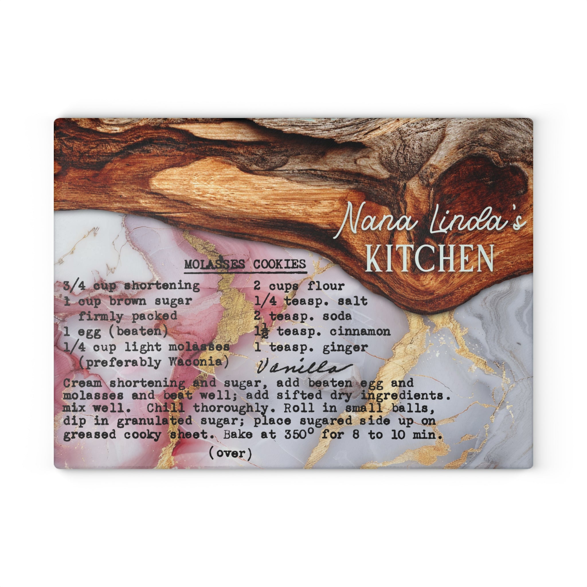 A square decorative sign or print featuring a marble-style background with a wooden spoon, the text 'Nana Linda's KITCHEN,' and a recipe for vanilla molasses cookies printed in black script and block lettering.