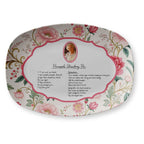 Decorative plate with floral design and recipe for Pineapple Strawberry Pie on a white background
