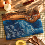 A personalized wooden recipe card for 'Nana Linda's Kitchen' styled on a rustic wooden table with onions, a knife, a checkered cloth, and wooden spoons.