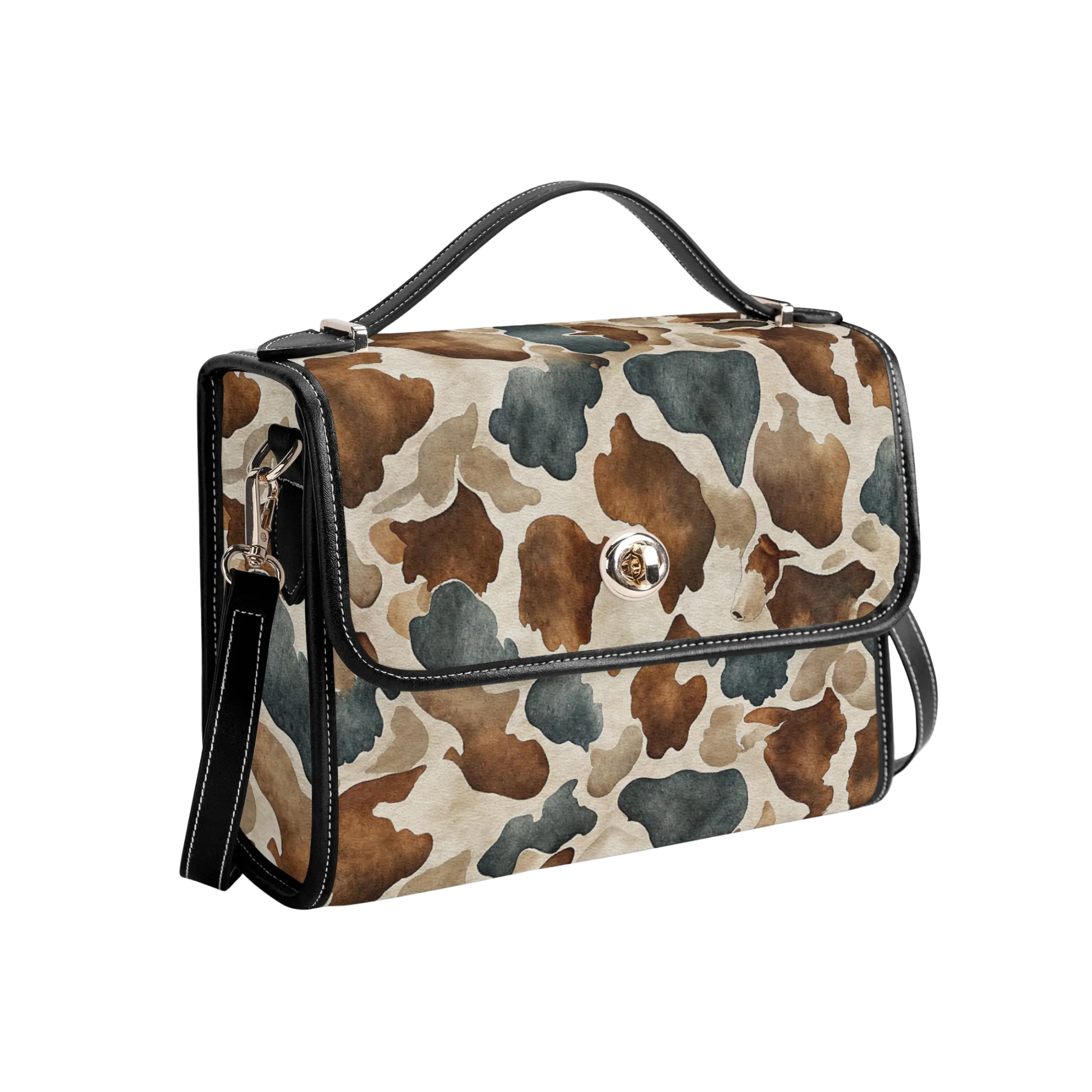 A structured handbag with a brown, beige, and gray watercolor cow print pattern, featuring black leather trim, a top handle, and a front flap with a silver-tone snap button.