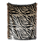 Zebra patterned throw blanket with fringes on a white background
