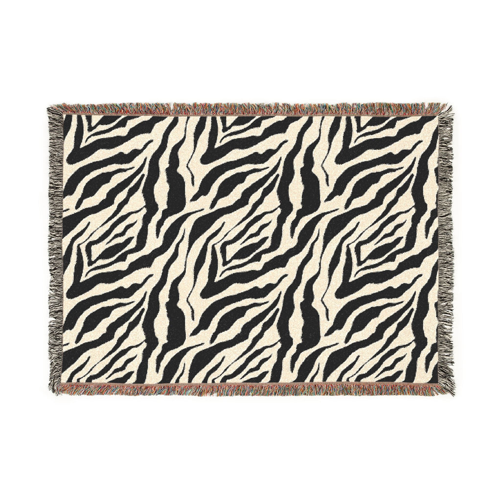 Zebra patterned throw blanket on a white background