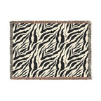 Zebra patterned throw blanket on a white background