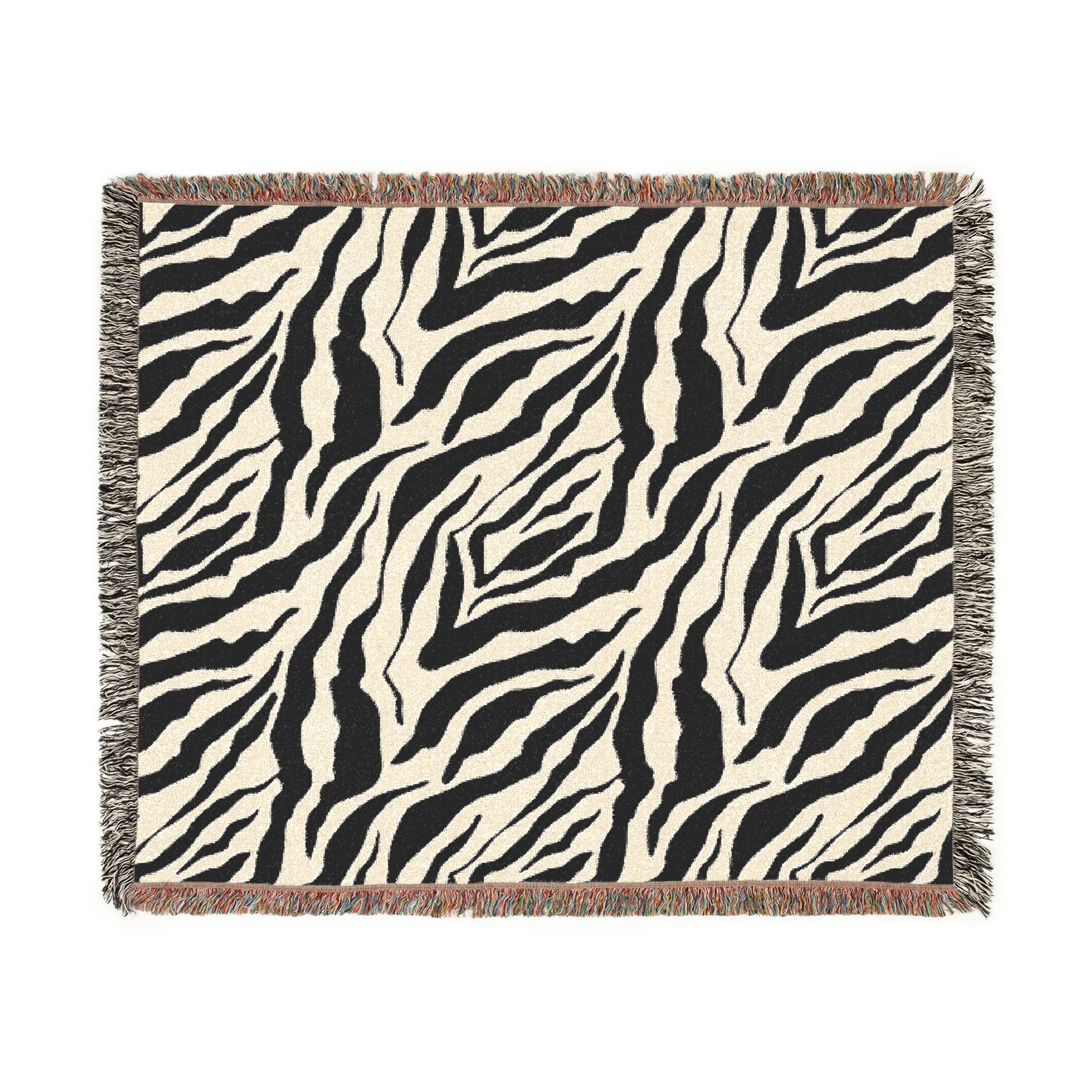 Zebra patterned throw blanket on a white background