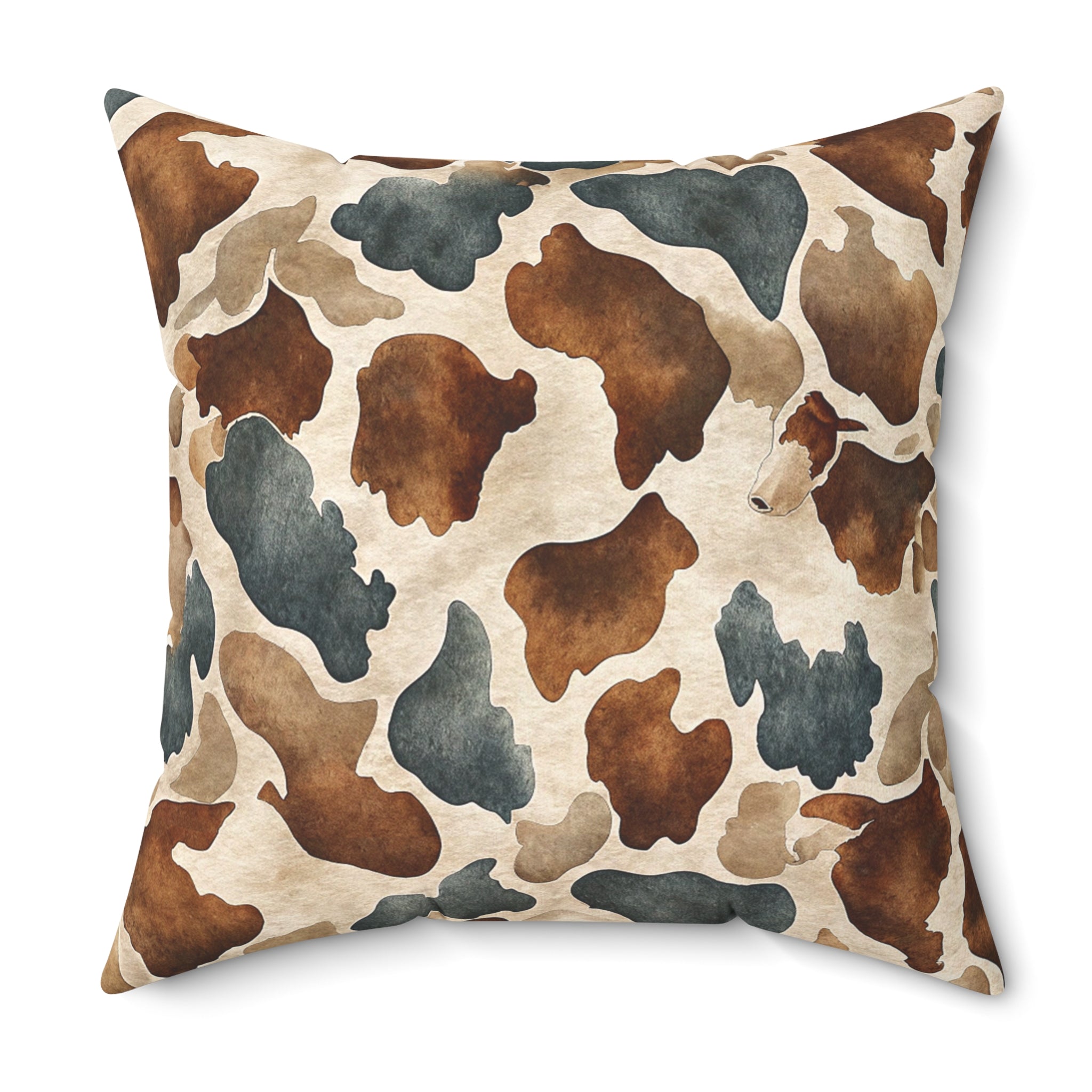 A square throw pillow featuring a watercolor cow print pattern in brown, beige, and slate blue-gray on a white background.